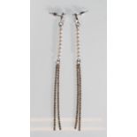 A pair of silver drop earrings having oval CZ's above a strand of pearls and double strands of round