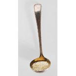 An English hallmarked Barnard & Sons 19th Century Victorian strainer spoon having pierced scrolled