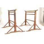 A pair of vintage 20th Century industrial cast trestles, the adjustable trestle ends raised on