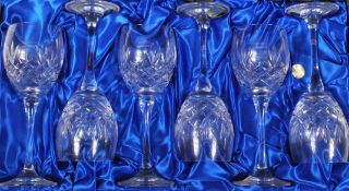 A set of six Bohemia Crystal cut glass wine glasses having star cut design with and rounded stems.