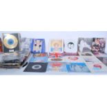 A collection of 45 RPM vinyl 7" singles from several artists to include a gold framed single by