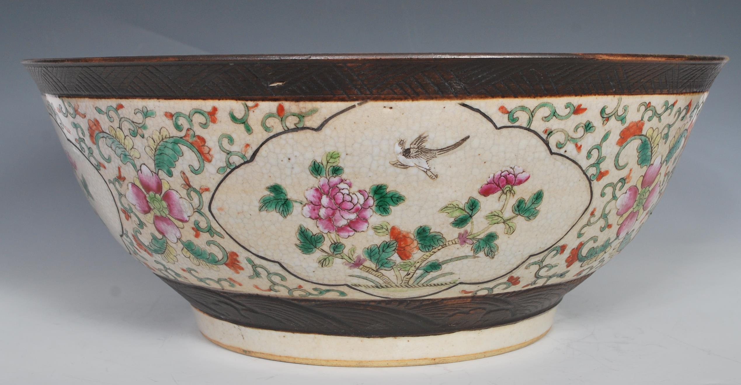 A large 19th Century Chinese crackle glazed pedestal punch bowl decorated with peony and bird in - Image 3 of 7