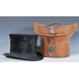 A 19th century gentleman's silk top hat, possibly French having inset coat of arms with rampant lion