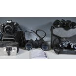 A small group of cameras and binoculars to include makes and models from Minolta Dynax 300si
