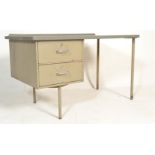 A retro mid 20th Century industrial single pedestal desk, raised on metal tubular legs with a single