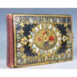 A lovely 19th Century Victorian photograph album. The cover having hand painted floral cartouche