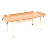 A vintage 20th Century teak wood Atomic folding metamorphic bed tray, two sets of folding metal