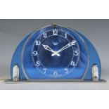 A 1930’s Art Deco blue glass mantel clock of arched form having blue glass with a chrome back