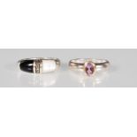 A silver ring set with a single faceted cut amethyst on a gold coloured mount. Ring size O. Together