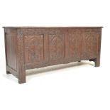 A part 17th century and late carved oak carved panel coffer chest. Raised on stile legs with a