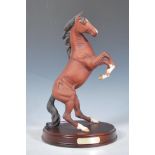 A Royal Doulton ceramic horse figurine titled ' Spirit of the Wild ', the figurine modelled as a