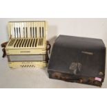 A vintage 20th Century Hohner Junior II accordion in original case, light pearlescent  facia to