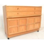 A retro 20th Century teak wood Nathan sideboard / credenza having four drawers to the top with
