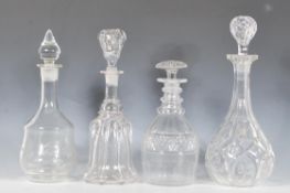 A collection of four cut glass decanters dating from the 19th Century. Each of different designs
