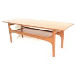 A 20th Century retro vintage teak wood coffee / centre table having a flat top raised on tapering