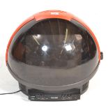 A vintage / retro Philips Discoverer Television set, shaped as a spaceman's helmet in red and