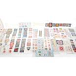 A collection of vintage 20th Century samples of woven clothing labels and ribbons from Cash's in