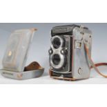 A vintage 20th Century Yashica - D Copal-MXV camera No. 650538. The black cased camera having a twin