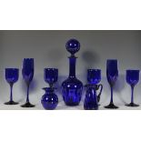 A group of Bristol Blue glass to include a decanter having a large round stopper, wine glasses and