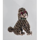 A silver and marcasite brooch / pendant in the form of a poodle set with red stone eyes having a