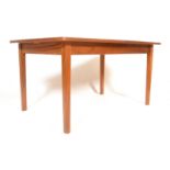 A retro 20th Century William Lawrence Costella range teak wood extendable dining table, flared top