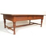 A good 20th century large mahogany coffee / occasional table being raised on fluted legs with fluted