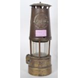 A late 19th / early 20th Century Eccles Manchester miners lamp of typical brass construction with
