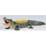 A cold painted bronze pincushion modelled as an alligator in the manner of Bergman. Pincushion to