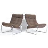 A pair of 20th century sling / lounge chairs / armchairs having chromed tubular metal construction