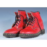 A pair of vintage Dr / Doc Martens 1990's red leather classic lace up boots having black laces and