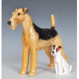 A 20th Century Beswick ceramic figurine in the form of a fox terrier painted in black and brown,