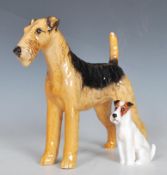 A 20th Century Beswick ceramic figurine in the form of a fox terrier painted in black and brown,