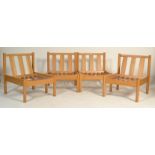 A set of 4 20th century  retro Ercol solid beech wood blonde low lounge chairs, the chair fitted