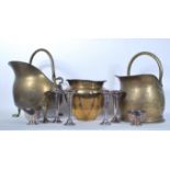 A collection of three pieces of brass wares to include two 19th Century fireside coal scuttles,