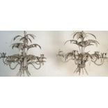 A pair of 20th Century country house ceiling chandeliers having curved foliate arms with floral