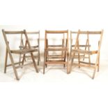 A set of six vintage 20th century beech wood dispersal / village hall / church folding chairs,