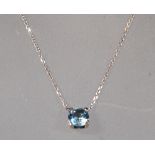 An 18ct white gold drop pendant necklace set with a faceted cut blue topaz on an 18ct white gold