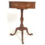 An early 20th Century mahogany side table being raised on a knopped column with tripod base below,
