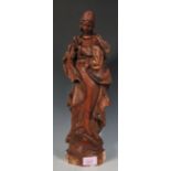 A 19th Century French carved oak ecclesiastical figurine depicting Saint Martha with clasped hands