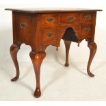 An 18th century revival solid mahogany lowboy - writing table desk. Raised on cabriole legs with pad