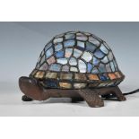 A 20th Century Tiffany style desk top table lamp in the form of a tortoise, the shell being leaded