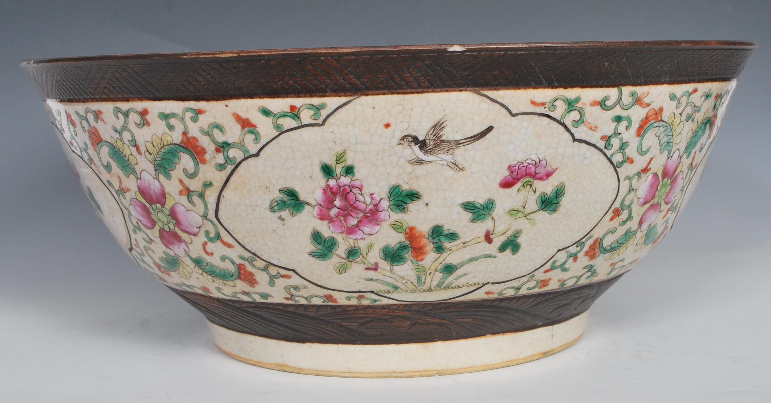 A large 19th Century Chinese crackle glazed pedestal punch bowl decorated with peony and bird in - Image 4 of 7