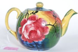 A late 19th / early 20th Century Wemyss pottery teapot having cabbage rose decoration to the multi