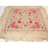 An early 20th Century circa 1920's hand worked table cloth, vivid coloured flowers throughout having