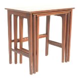 A good mid century Danish teak wood nest of tables. Raised on shaped supports with chamfered