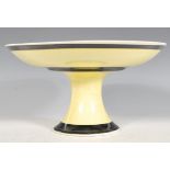 An Art Deco style Lorna Bailey Tazza / comport / cake stand, the plate raised on a pedestal base