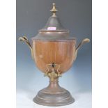 A 19th Century copper and brass Samovar, twin ebonised carrying handles,brass tap raised on a