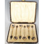 A cased set of six early 20th Century silver hallmarked coffee bean finial spoons. Hallmarked for