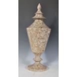 A 20th Century polished marble / granite urn of Pagoda form, raised on a circular base with the body