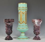 A pair of 19th Century Victorian presses purple slag glass pedestal vases of classical form together